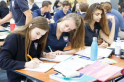Students write into their notebooks in class