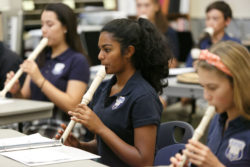 Students play instruments in music class