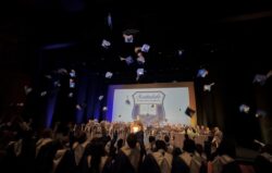 graduation hats being thrown in the air